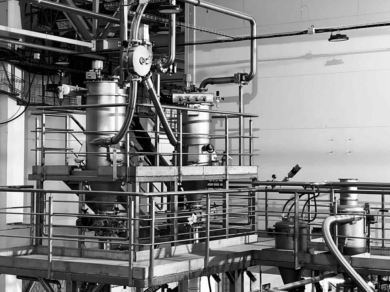 Stainless steel piping and process vessels on a platform